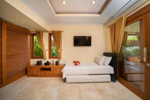 Bali Mynah Villas Resort tesisinde bir oturma alanı