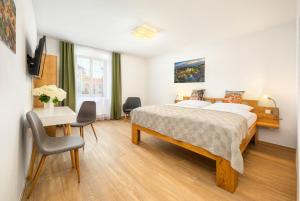 Postel nebo postele na pokoji v ubytování Hotel Garni Villa Areka