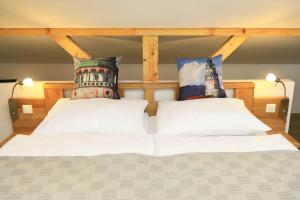 Postel nebo postele na pokoji v ubytování Hotel Garni Villa Areka