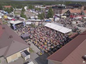 an overhead view of a crowd of people at a festival at CityBed Bed & Breakfast in Pajala +4 photos