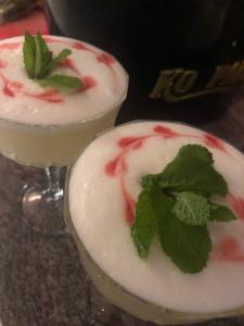two cocktails with a mint leaf on top of them at CityBed Bed & Breakfast in Pajala