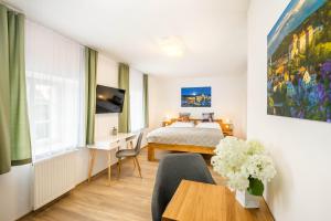 Postel nebo postele na pokoji v ubytování Hotel Garni Villa Areka