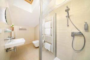 Koupelna v ubytování Hotel Garni Villa Areka