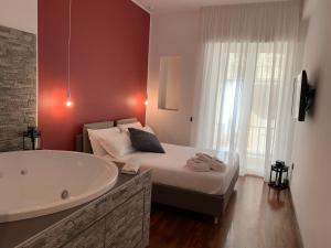 Postel nebo postele na pokoji v ubytování Cellamare Suite & Spa