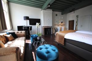 Katil atau katil-katil dalam bilik di Boutique Hotel Steenhof Suites - Adults Only