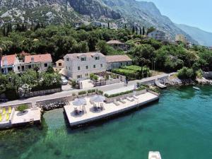 an aerial view of a house on the water at Vila Maestral Kotor in Kotor