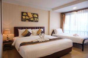 Ένα ή περισσότερα κρεβάτια σε δωμάτιο στο MD Boutique Hotel +56 φωτογραφίες
