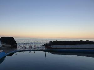 a group of bikes parked next to the water at Casa Rotas a Nordeste in Nordeste