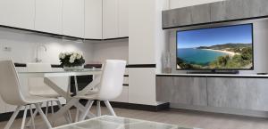 a kitchen with a large window with a view of a beach at Space Apartment in Cagliari