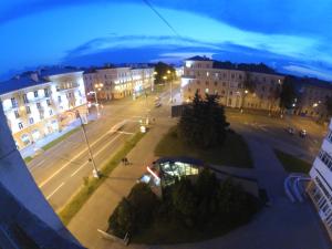 a view of a city street at night with buildings at Apartment on Lenin Avenue in Gomel