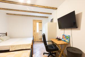 TV a/nebo společenská místnost v ubytování Krk Patak