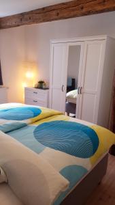 Ένα ή περισσότερα κρεβάτια σε δωμάτιο στο Ferienwohnung zur Seepromenade, 100m vom Bodensee