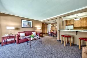 a living room with a couch and a table at Forest Suites Resort at the Heavenly Village in South Lake Tahoe