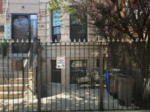 a wrought iron fence in front of a house at Brooklyn's Finest - Cozy 2 Bedroom in Brooklyn