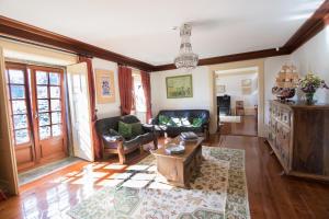 a living room with a couch and a table at Casa do Monte - Douro in Baião