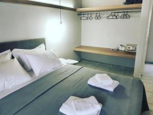 Posteľ alebo postele v izbe v ubytovaní Avres Apartments