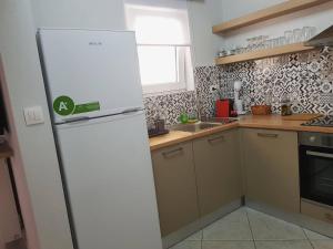 Kuchyňa alebo kuchynka v ubytovaní Avres Apartments