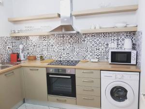 Kuchyňa alebo kuchynka v ubytovaní Avres Apartments