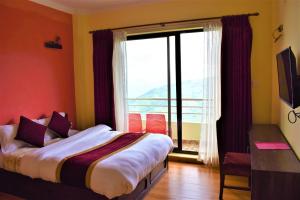 Postel nebo postele na pokoji v ubytování Hotel Nagarkot Inn + 37 fotografií