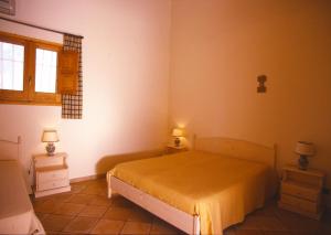 A bed or beds in a room at Agriturismo Al Casale