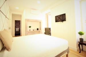 TV a/nebo společenská místnost v ubytování Frutaria - Lisbon Suites