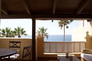 a balcony with a view of the ocean at Luxury Villa del Mar - Bahia Feliz in Maspalomas