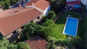 an overhead view of a house with a swimming pool at Casa Rural Las Gamellas in Rebollar