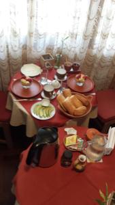 a table with plates of food and bread on it at Miraflores Centre in Lima
