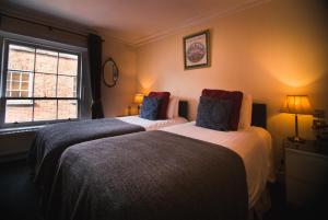 Ліжко або ліжка в номері Dublin Citi Hotel of Temple Bar