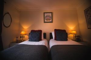 Ліжко або ліжка в номері Dublin Citi Hotel of Temple Bar