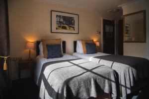 Ліжко або ліжка в номері Dublin Citi Hotel of Temple Bar