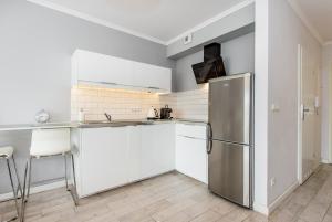 Kuchyňa alebo kuchynka v ubytovaní Super-Apartamenty Old Market + 18 fotografií