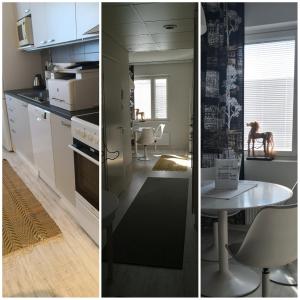a kitchen with white cabinets and a table and a kitchen with a dining room at Vinkkeli in Tampere