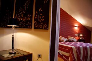 Postel nebo postele na pokoji v ubytování Hospedium Hotel Vittoria Colonna