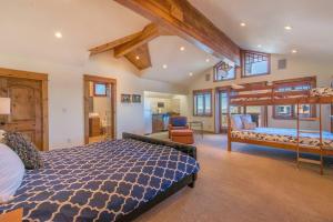 a bedroom with two bunk beds and a loft at Skislope-Tahoe Villa in Truckee