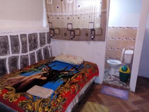 מיטה או מיטות בחדר ב-Casa LLEMO