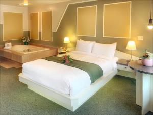 Postel nebo postele na pokoji v ubytování Motel La Cheminée
