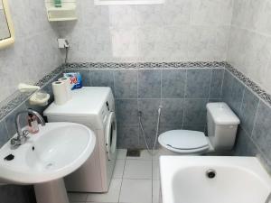 a bathroom with a sink and a toilet at Cosy apartment @ La marsa Corniche-Beach in La Marsa