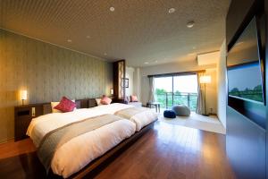 Postel nebo postele na pokoji v ubytování Hotel Green Plaza Hakone
