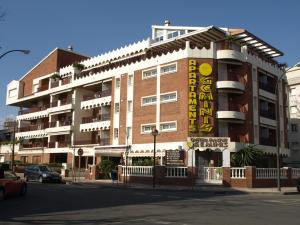 a building with a sign on the side of it at Apartaments Geminis in Cambrils