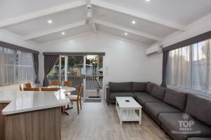 a living room with a couch and a table at Horsham Riverside Caravan Park in Horsham