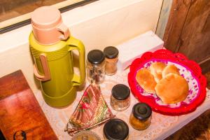 a table with a plate of bread and a thermos at BiosWild in Cusco