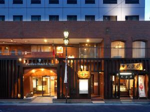 a building with a street light in front of it at PACIFICO Hotel and Spa in Iwaki