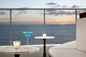 a drink on a table in front of the ocean at Hyatt Regency Tokyo Bay in Urayasu