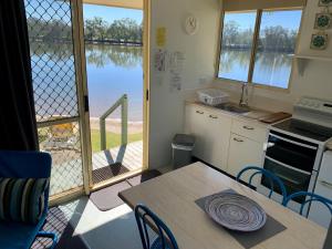 
A kitchen or kitchenette at Maroochy River Resort & Bungalows
