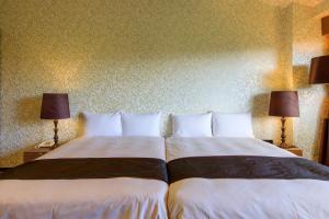 Postel nebo postele na pokoji v ubytování Hotel Green Plaza Hakone