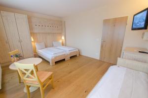 Łóżko lub łóżka w pokoju w obiekcie JUFA Hotel Weinviertel - Eselsmühle