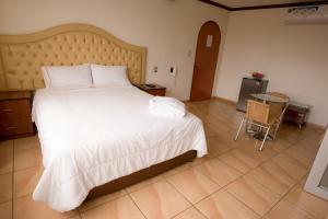 Katil atau katil-katil dalam bilik di Hotel Wayra