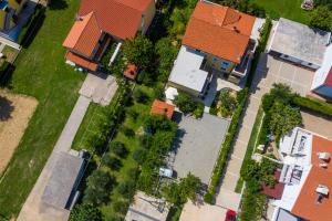 an overhead view of a house with a yard at Apartments Marija in Baška