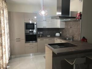 A kitchen or kitchenette at Marsascala Sea View Apartment HPI 7738